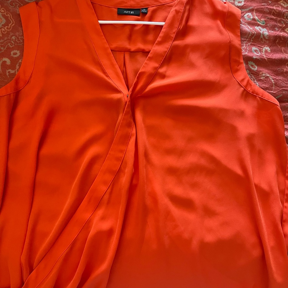 Sleeveless blouse. Orange.